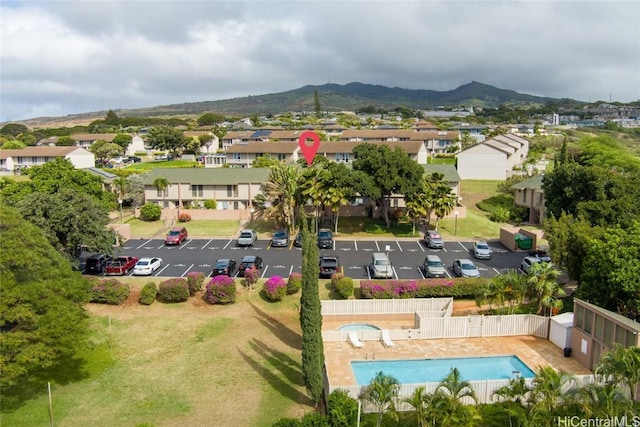 birds eye view of property featuring a mountain view and a residential view