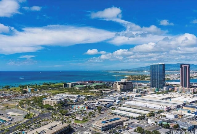 birds eye view of property with a view of city and a water view