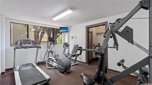 581 Kamoku St Unit 504, Honolulu, HI 96826 - exercise area with a textured ceiling and baseboards