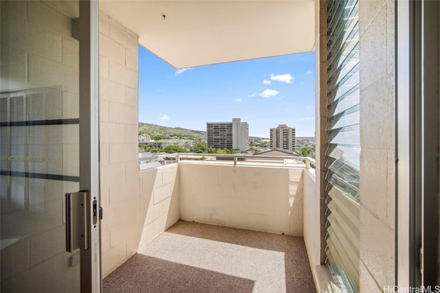 balcony featuring a city view