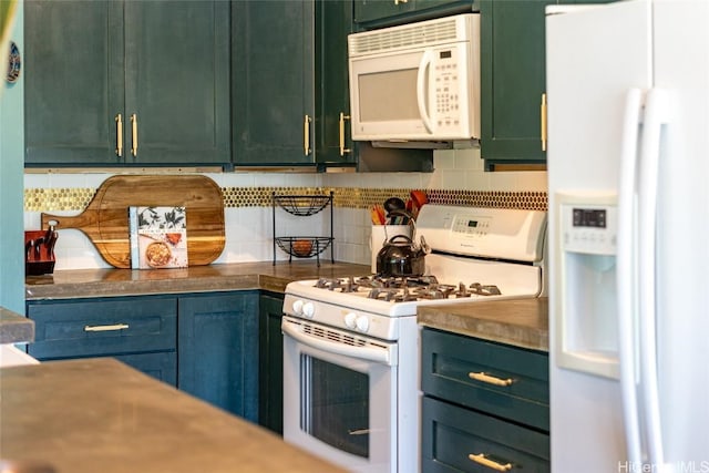 kitchen with decorative backsplash, white appliances, and green cabinetry