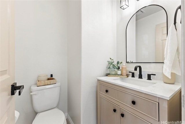 half bath with toilet and vanity