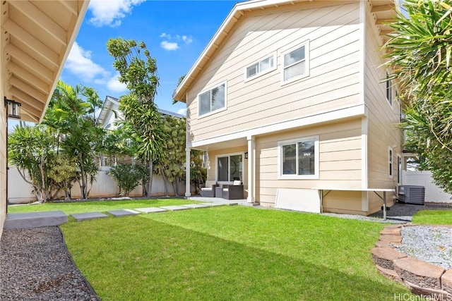 back of house featuring a lawn, cooling unit, outdoor lounge area, a fenced backyard, and a patio