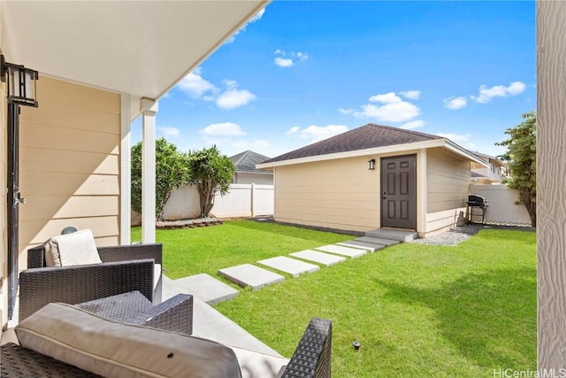 view of yard with an outdoor hangout area, an outbuilding, and a fenced backyard