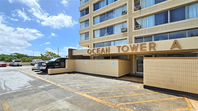 view of property featuring uncovered parking