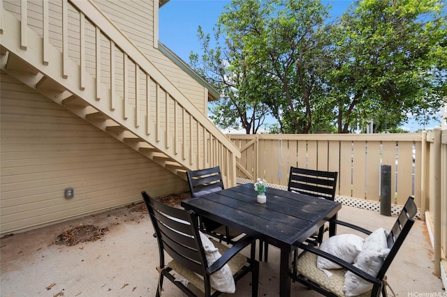 91-1018 Kaiau Ave Unit 1G, Kapolei, HI 96707 - view of patio featuring outdoor dining space, stairway, and fence