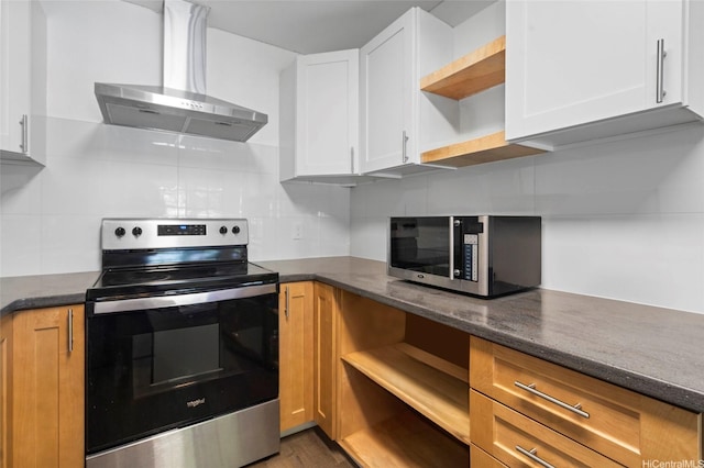 91-1018 Kaiau Ave Unit 1G, Kapolei, HI 96707 - kitchen with dark stone counters, wall chimney range hood, open shelves, white cabinets, and stainless steel appliances