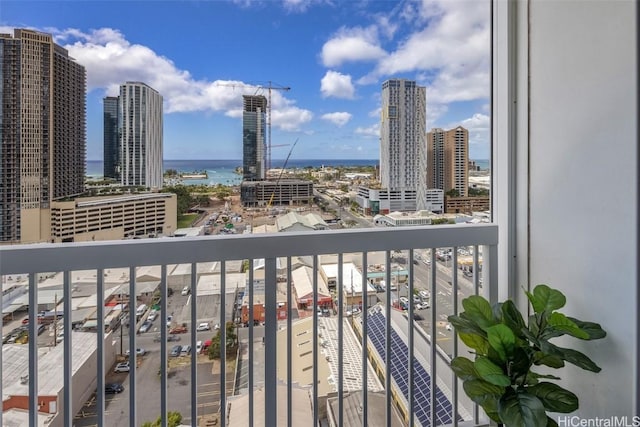 balcony with a view of city and a water view