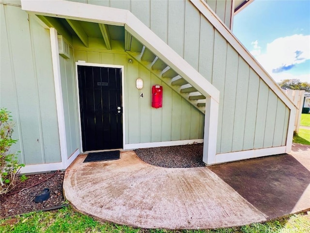 property entrance with board and batten siding