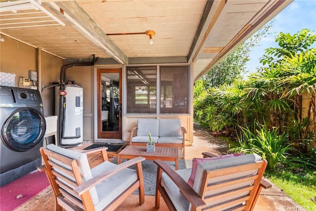 view of patio / terrace with an outdoor living space, washer / clothes dryer, and water heater