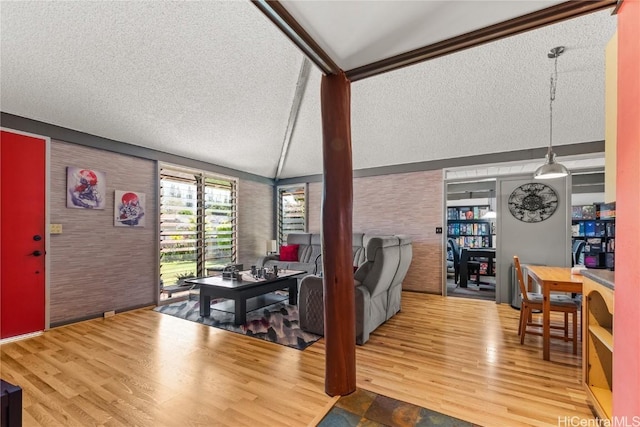 living room featuring a textured ceiling and wood finished floors