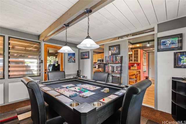 recreation room featuring beam ceiling and wood ceiling