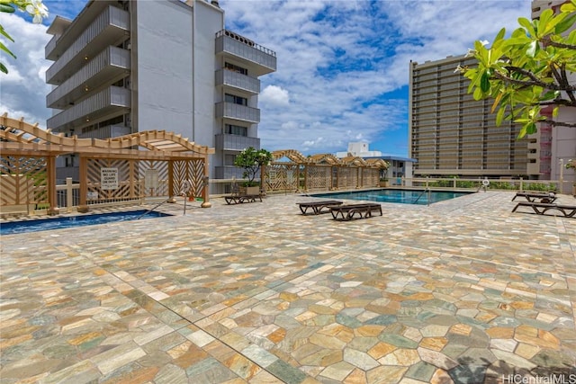 community pool featuring a patio area