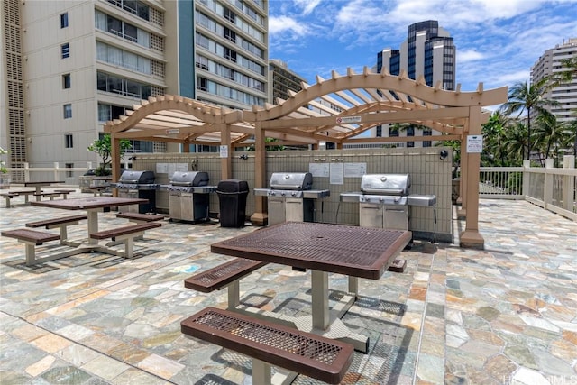 view of patio / terrace featuring a grill and a pergola