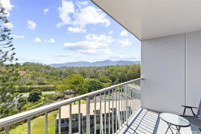 balcony with a mountain view and a forest view