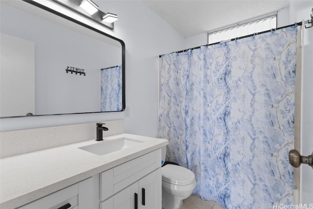 bathroom featuring vanity, a shower with shower curtain, toilet, and tile patterned flooring