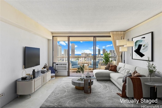 carpeted living room with cooling unit and a textured ceiling