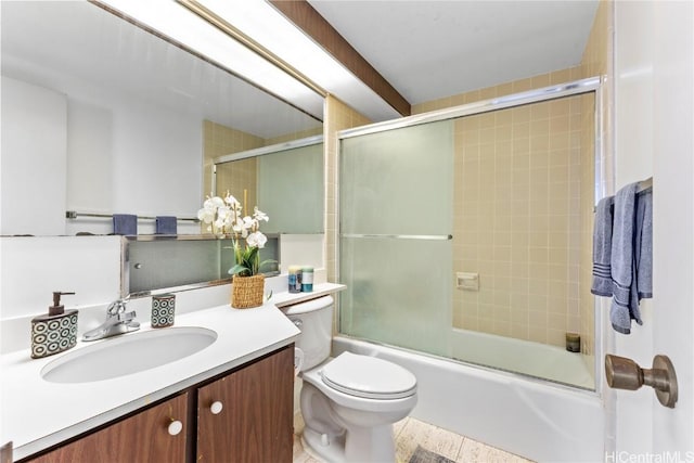 bathroom featuring vanity, toilet, and enclosed tub / shower combo