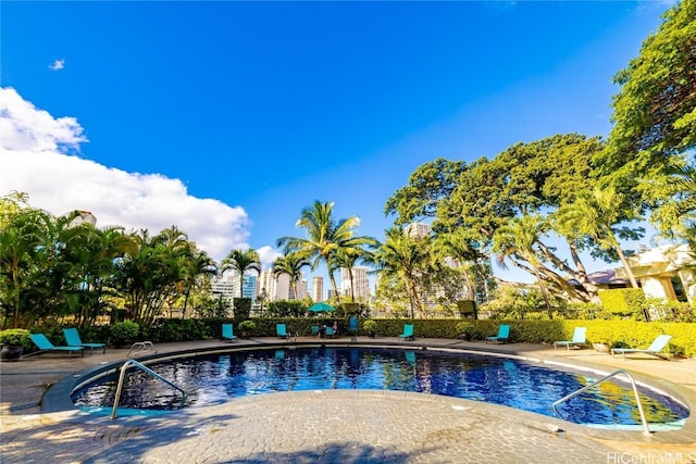 community pool featuring a patio area