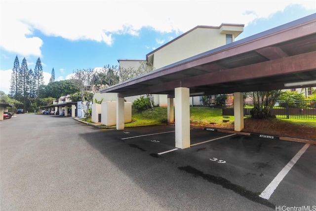 covered parking lot with fence