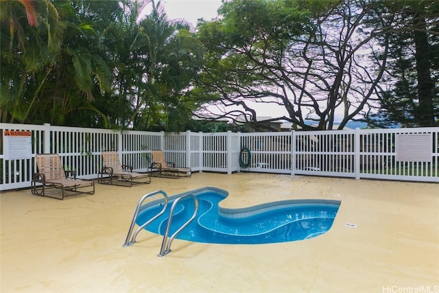 view of pool with a patio, fence, and a fenced in pool