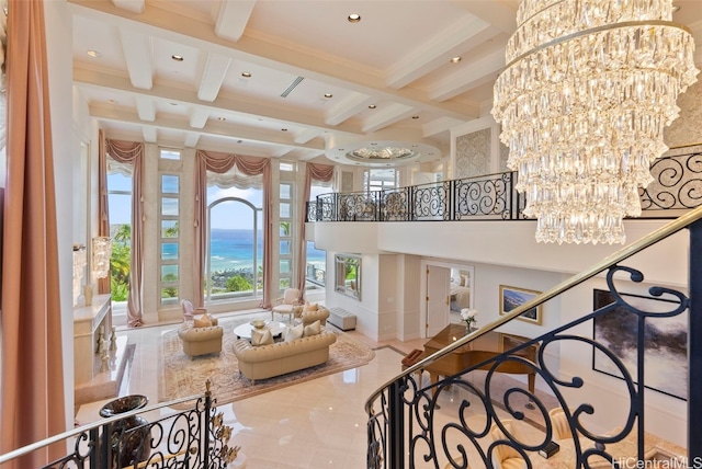 stairway featuring beamed ceiling, recessed lighting, a high ceiling, an inviting chandelier, and coffered ceiling