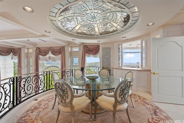 dining room with recessed lighting, crown molding, and light tile patterned floors