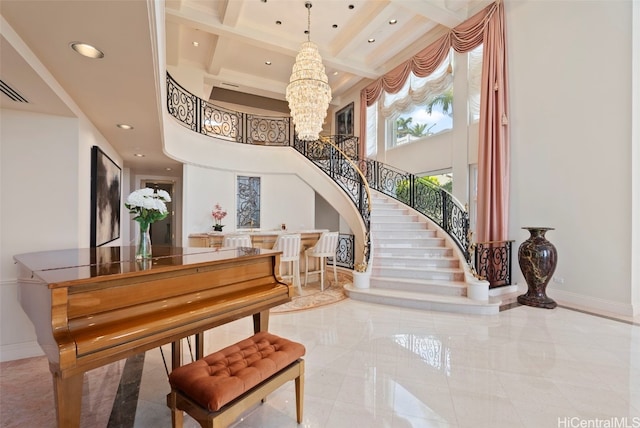 stairway featuring baseboards, beamed ceiling, recessed lighting, an inviting chandelier, and a towering ceiling