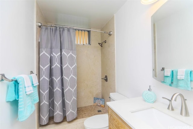 bathroom featuring a shower with curtain, toilet, and vanity