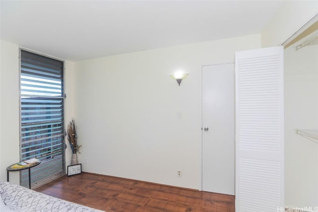 unfurnished bedroom featuring wood finished floors