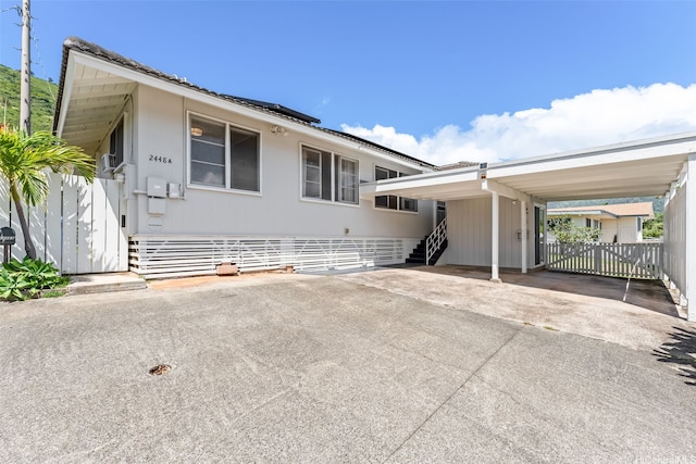 2448A E Manoa Rd, Honolulu, HI 96822 - view of front of house with driveway and an attached carport