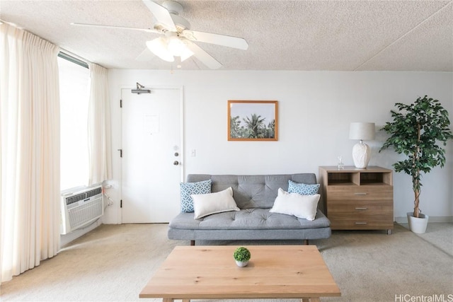 living area with light carpet, a textured ceiling, and ceiling fan