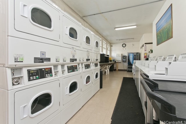 community laundry room with stacked washer and dryer and washer and clothes dryer