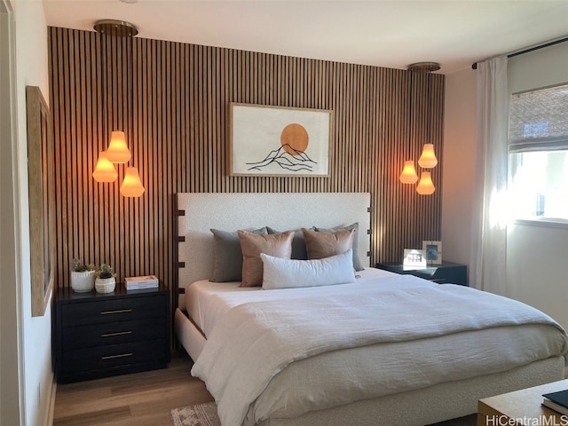 bedroom featuring wood finished floors