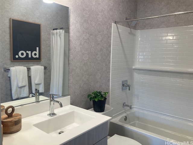 full bathroom with toilet, shower / bath combo, vanity, and wallpapered walls