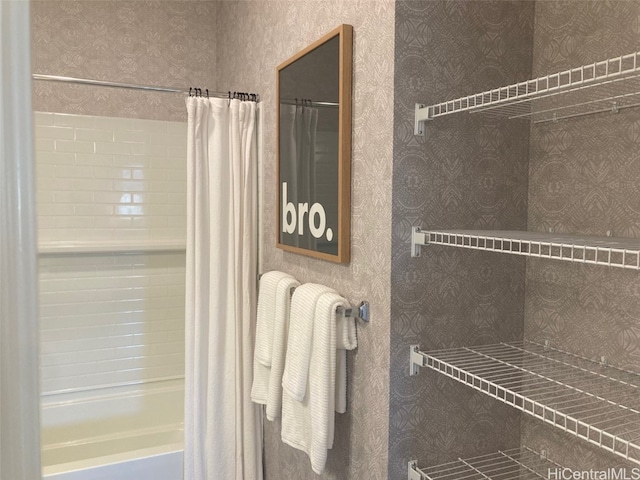 full bathroom featuring shower / tub combo with curtain and wallpapered walls