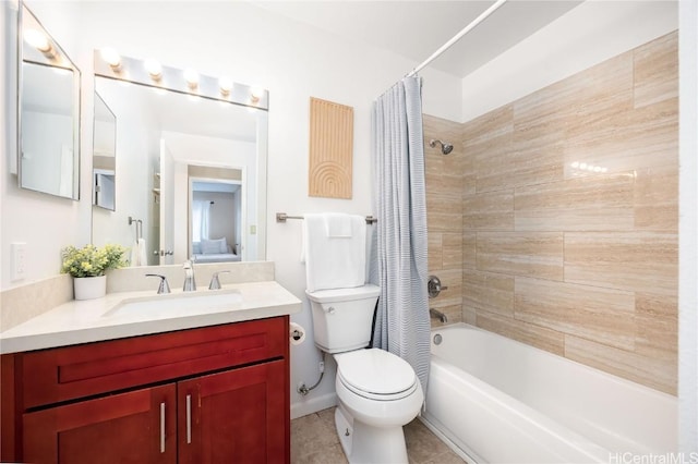 bathroom with vanity, tile patterned floors, toilet, and shower / bath combo