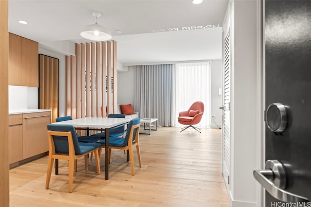 dining area featuring recessed lighting and light wood-style floors