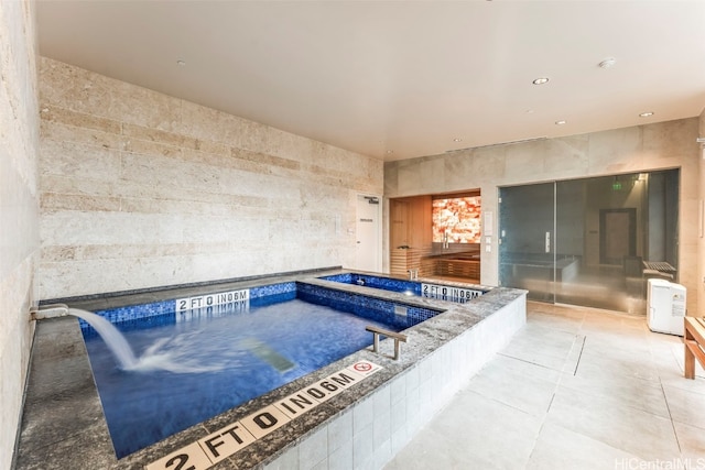 view of pool with an indoor hot tub