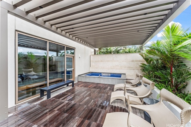 deck featuring a patio area and a pergola