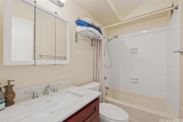 bathroom with toilet, vanity, and shower / bathing tub combination