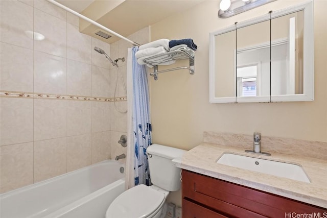 bathroom featuring vanity, toilet, and shower / tub combo