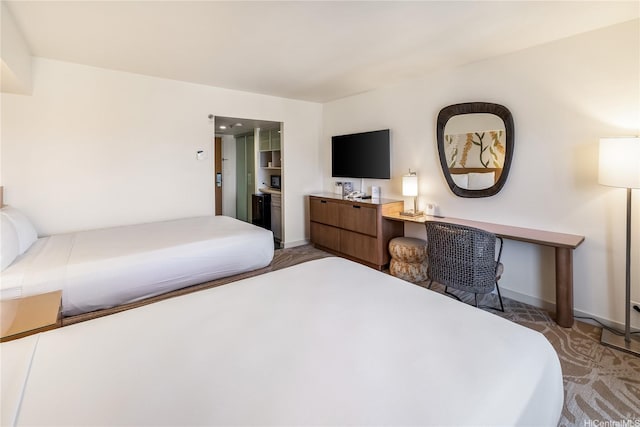 410 Atkinson Dr Unit 1609, Honolulu, HI 96814 - bedroom with a desk, baseboards, and light carpet