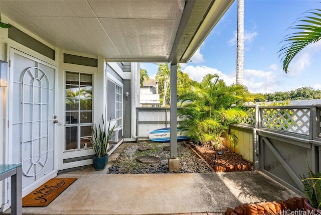 view of patio featuring cooling unit and fence