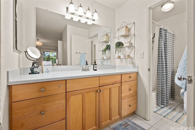 full bathroom featuring tile patterned flooring, curtained shower, and vanity