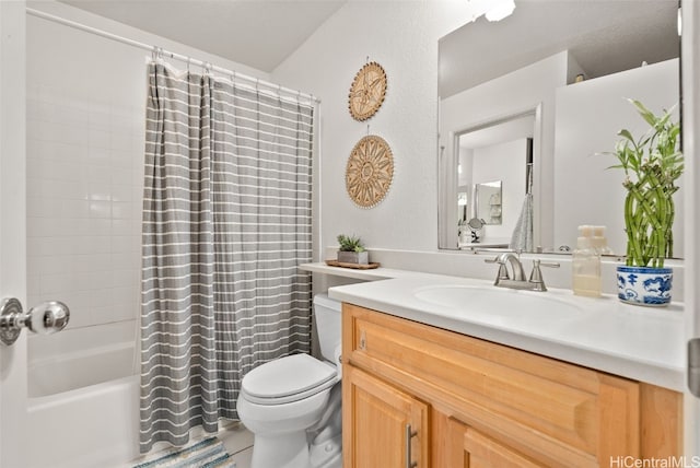 bathroom featuring vanity, shower / bath combination with curtain, and toilet