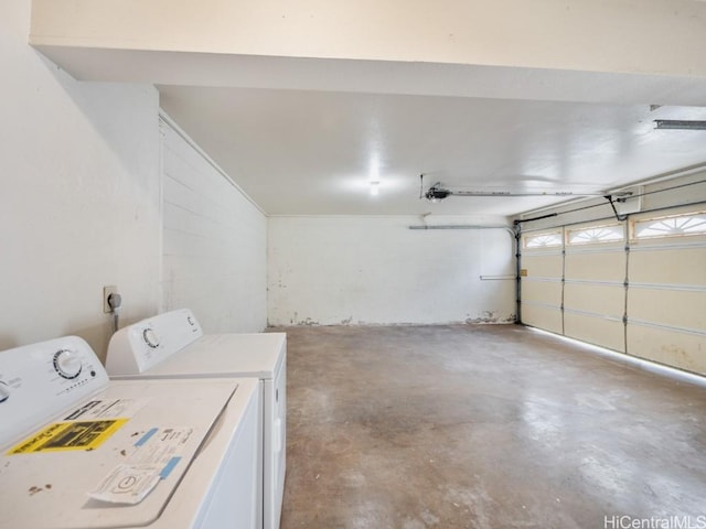 laundry room with washer and clothes dryer, laundry area, and a garage