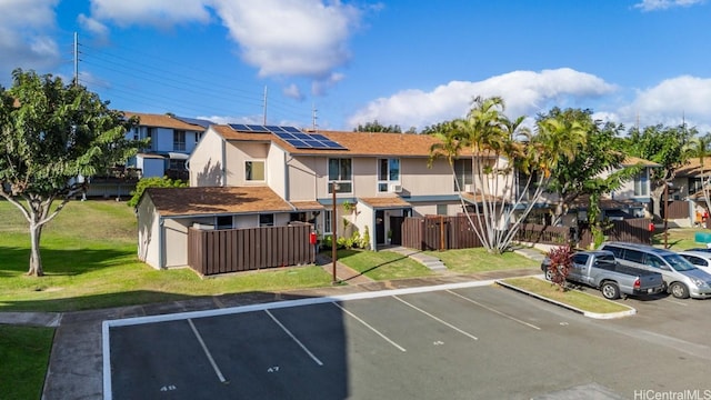 exterior space with fence and a residential view