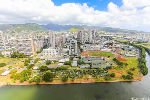 drone / aerial view with a view of city and a water and mountain view