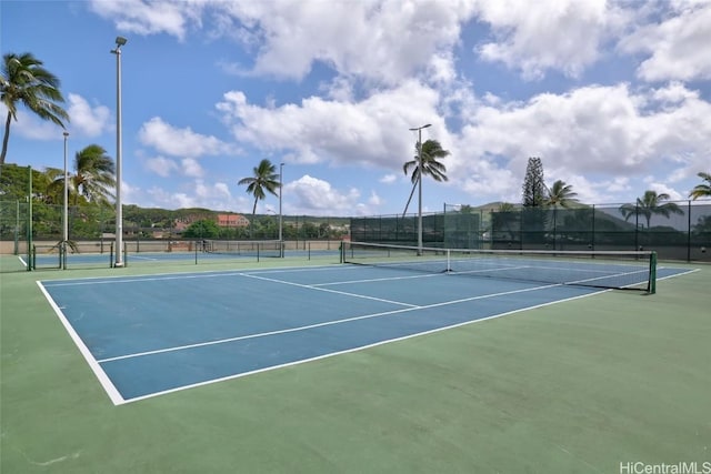 view of sport court with fence